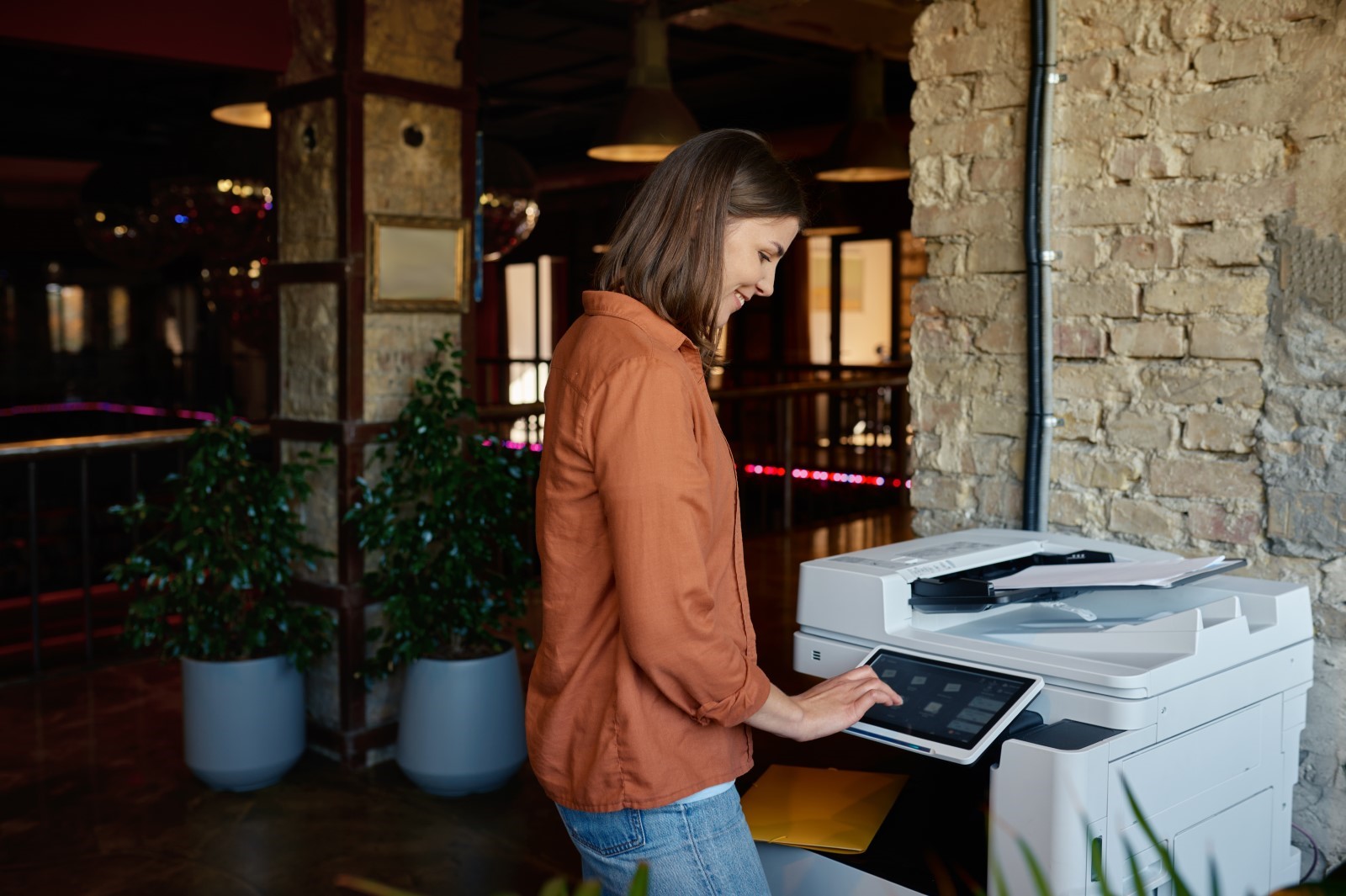 woman using a managed print device