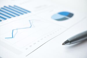 Printouts of managed print statistics and a pen